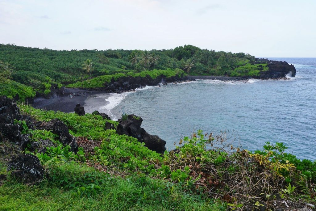 Honokalani Beach offers infamous black sands formed from the battering of lava flows and ocean waves for a thousand years.